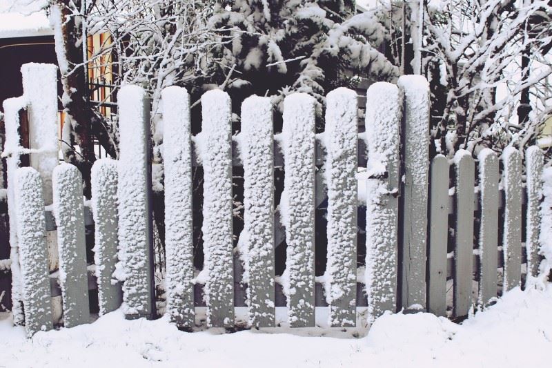 Snow on a picket fence in Oxford