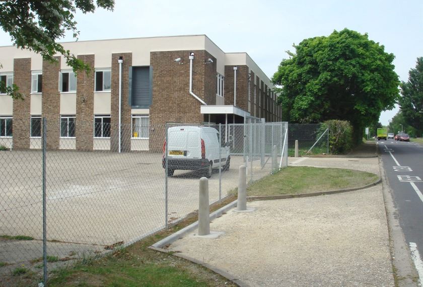 Chain-link fence bordering commercial property