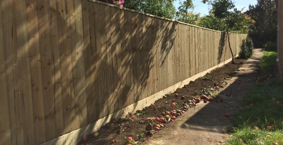 Gravel boards under close-board fencing