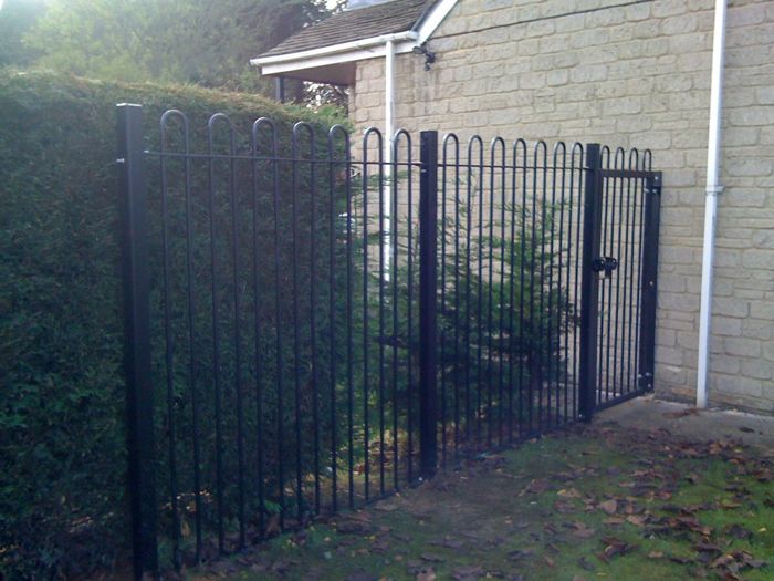 2.1m high steel bow top railings & gate.