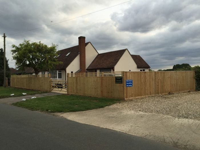 Close board fencing with slatted trellis