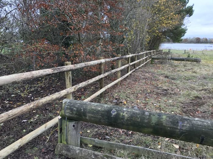 Round UC4 post and half round rail fencing