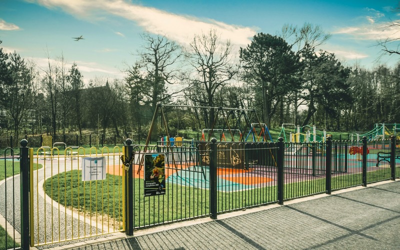 Bow-top fencing around a playground