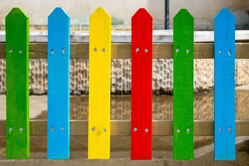 A colourful playground fence